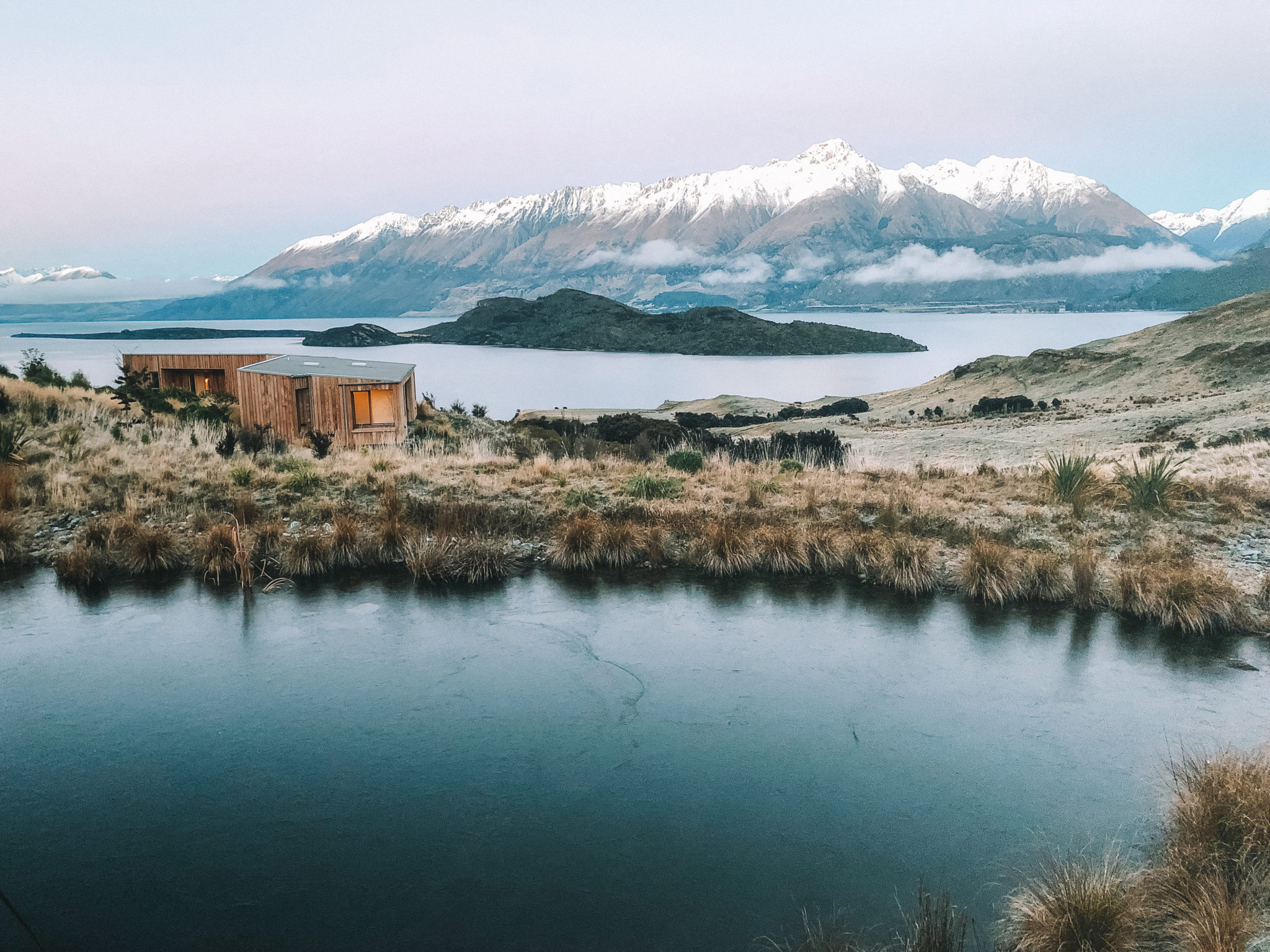 Alpine tarn at Aro Hā with Lake Wakatipu and mountains beyond